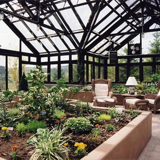 Photo of a large contemporary detached greenhouse in Vancouver.