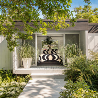 Example of an island style detached guesthouse design in New York