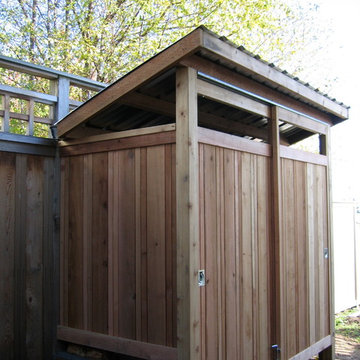 Firewood shed built with reclaimed materials.