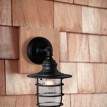 Freeport 1 Light Outdoor Medium Sconce in Antique Iron with a Clear Ribbed Glass