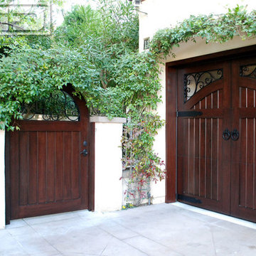 Garage Doors and Entry Gates Designed to Match in a European Architectural Style