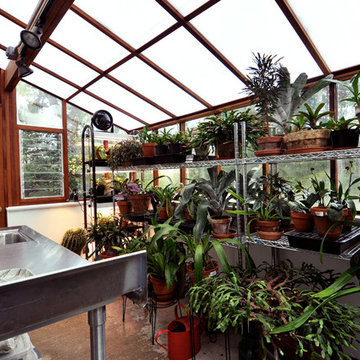 Jalousie windows add ventilation to this Wisconsin greenhouse
