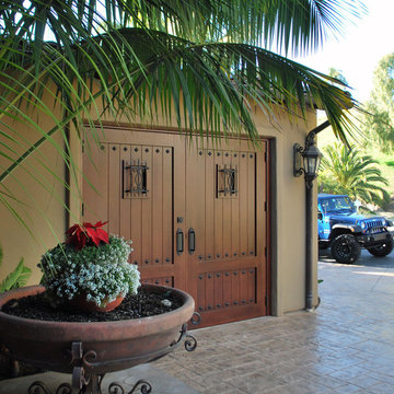 Mediterranean Carriage House Style Garage Doors That Swing Open for Pedestrians!