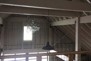 Example of a large country detached barn design in Other