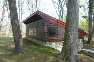 Example of a small mountain style detached studio / workshop shed design in New York