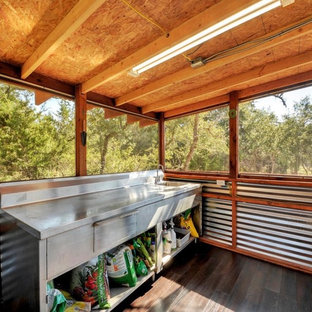 Mid-sized mountain style shed photo in Austin
