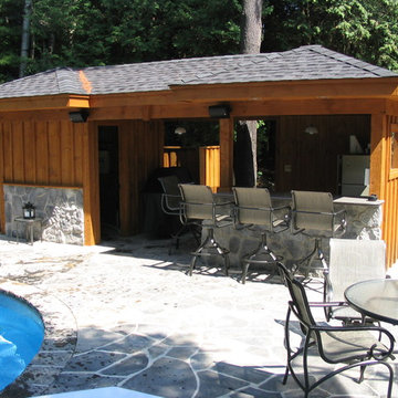 Rough Sawn Pine Pool Shed with Stone Detail