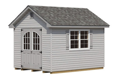 This is an example of a medium sized traditional garden shed in New York.
