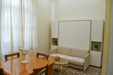 Foto de salón tipo loft de estilo americano de tamaño medio con paredes blancas y suelo multicolor