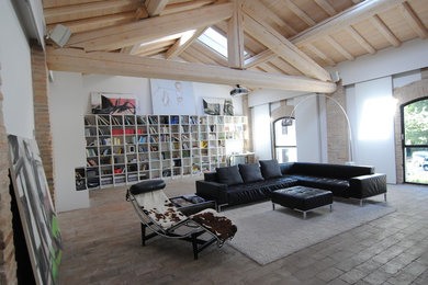 Design ideas for an expansive rural mezzanine living room in Bologna with white walls.