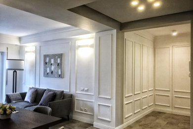 Idee per un soggiorno classico di medie dimensioni e stile loft con sala formale, pareti bianche, pavimento in gres porcellanato e TV a parete