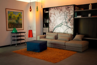 Diseño de salón para visitas tipo loft moderno de tamaño medio con pared multimedia