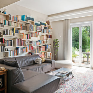 Foto di un soggiorno contemporaneo aperto con libreria e pareti beige