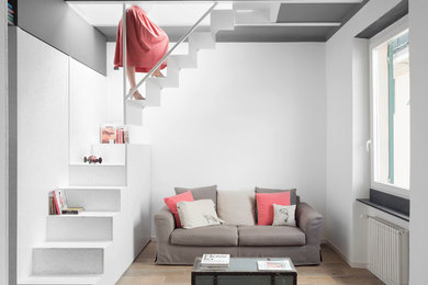 Immagine di un piccolo soggiorno scandinavo aperto con pavimento in gres porcellanato, pareti bianche, nessun camino e nessuna TV