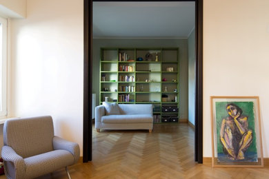 Example of a minimalist family room design in Milan