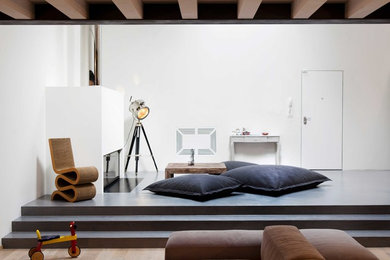 Esempio di un ampio soggiorno contemporaneo aperto con pareti bianche