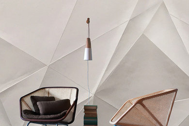 Ispirazione per un piccolo soggiorno minimal stile loft con libreria, pareti bianche e parquet scuro