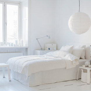Design ideas for a medium sized scandi guest bedroom in Stockholm with white walls, painted wood flooring and no fireplace.