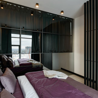 Diseño de dormitorio principal, actual, grande, con paredes blancas, suelo vinílico y suelo gris