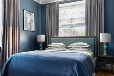 Photo of a classic master and grey and brown bedroom in Moscow with blue walls, medium hardwood flooring and brown floors.