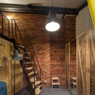 Foto de dormitorio tipo loft, industrial, con suelo de linóleo y paredes marrones