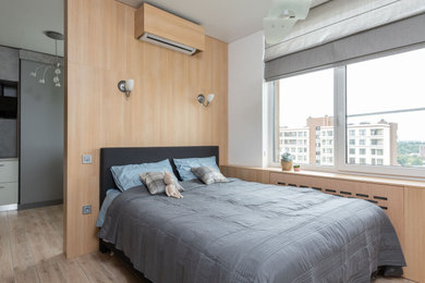 This is an example of a contemporary bedroom in Other with beige walls, ceramic flooring and beige floors.