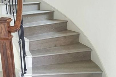 Inspiration for a medium sized classic wood curved wood railing staircase in Houston with wood risers.