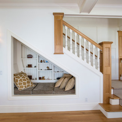 Mid-sized beach style wooden l-shaped staircase photo in Seattle with painted risers