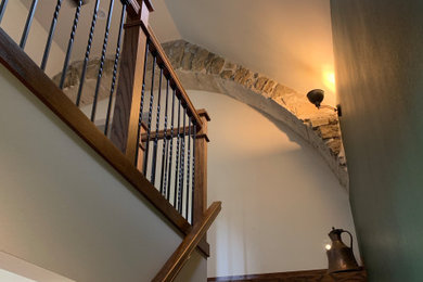 Example of a farmhouse wooden l-shaped mixed material railing staircase design in Other with wooden risers