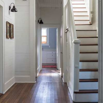 Example of a mid-sized country wooden straight wood railing staircase design in Austin with painted risers