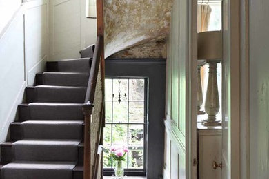 Design ideas for a rustic staircase in London with feature lighting.