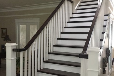 Inspiration for a large timeless wooden straight wood railing staircase remodel in Other with painted risers