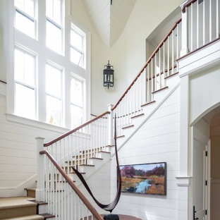 Beach style wooden l-shaped wood railing staircase photo in Charleston with painted risers