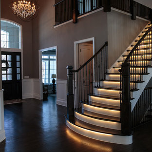 Large transitional wooden straight staircase photo in Chicago with painted risers