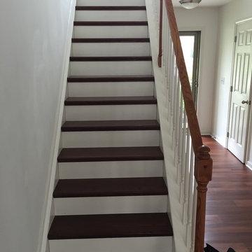 A finished carpet-to-hardwood staircase conversion.