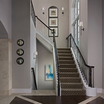 A gorgeous, high-ceiling custom home with flooring and the staircase done by Sup