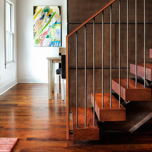 Large trendy wooden floating open staircase photo in Austin