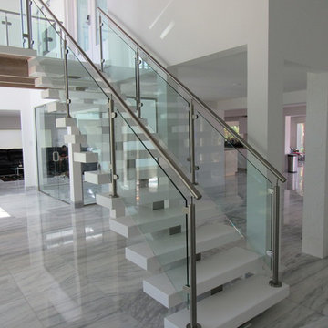 Aker Res Remodel. Glass, Steel and Pure White Treads