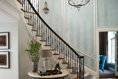 Example of a classic wooden curved staircase design in Raleigh with wooden risers