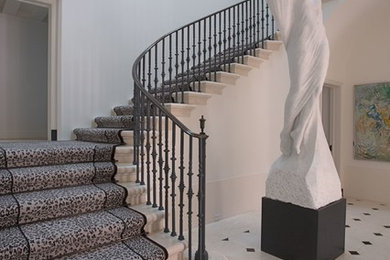 Example of a trendy u-shaped staircase design in Dallas