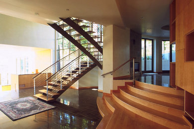 Staircase - huge modern wooden u-shaped open and mixed material railing staircase idea in San Francisco