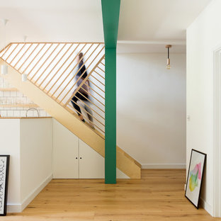Medium sized scandinavian straight wood railing staircase in London.