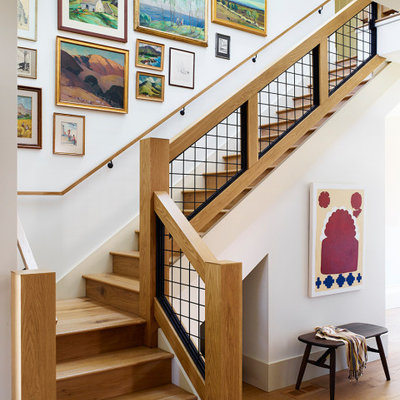 Staircase - large transitional wooden l-shaped metal railing staircase idea in San Francisco with wooden risers
