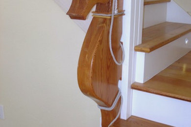 Foto de escalera ecléctica con escalones de madera
