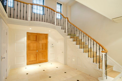 Inspiration for a contemporary wood staircase in Oxfordshire with wood risers.
