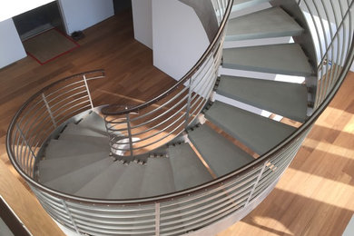 Inspiration for a huge modern concrete curved mixed material railing staircase remodel in Tampa