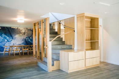 Example of a mid-sized wooden l-shaped wood railing staircase design in Austin with wooden risers