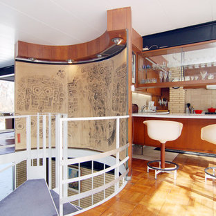 Example of a mid-century modern spiral staircase design in Other
