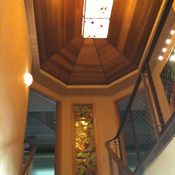 Art Glass Stairwell in Casually Elegant Sugar Cove Remodel