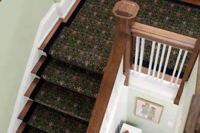 Staircase - mid-sized craftsman carpeted straight staircase idea in Toronto with painted risers